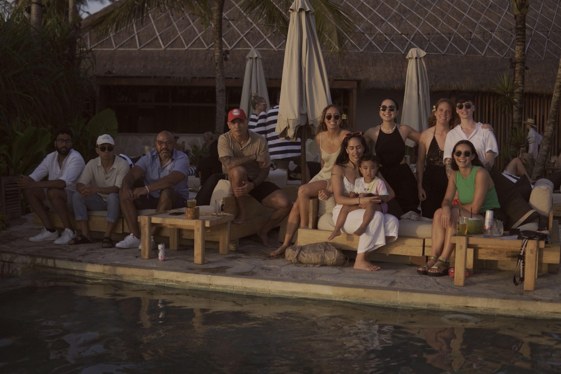Group poolside at golden hour